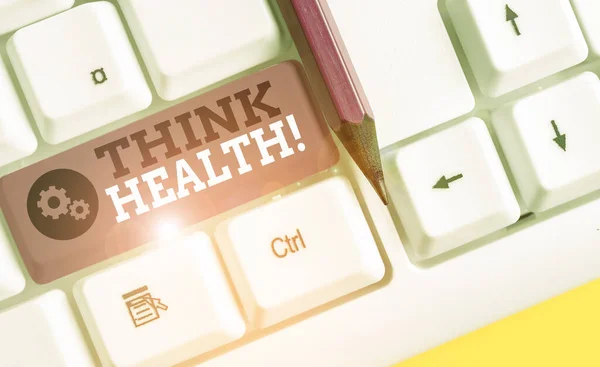 Escrita de mão conceitual mostrando Think Health. Foto de negócios mostrando estado de completo bem-estar físico e social teclado pc branco com papel de nota acima do fundo branco . — Fotografia de Stock