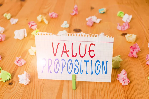 Text sign showing Value Proposition. Conceptual photo feature intended to make a company or product attractive Colored crumpled papers empty reminder wooden floor background clothespin. — Stock Photo, Image