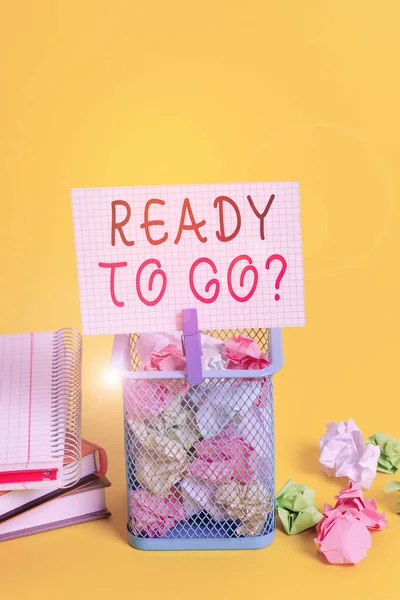 Conceptual hand writing showing Ready To Go Question. Business photo text asking someone if he is prepared or packed his things Trash bin crumpled paper clothespin office supplies yellow.