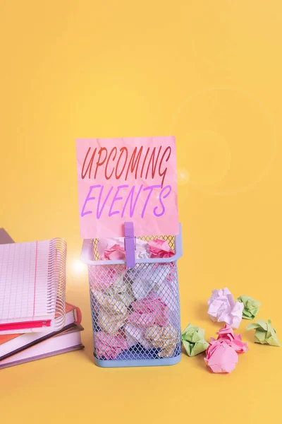Text sign showing Upcoming Events. Conceptual photo the approaching planned public or social occasions Trash bin crumpled paper clothespin empty reminder office supplies yellow. — 스톡 사진