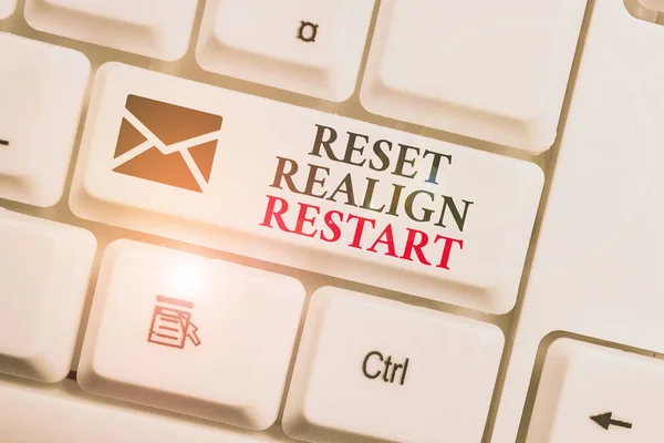 Text sign showing Reset Realign Restart. Conceptual photo Life audit will help you put things in perspectives White pc keyboard with empty note paper above white background key copy space. — Stock Photo, Image