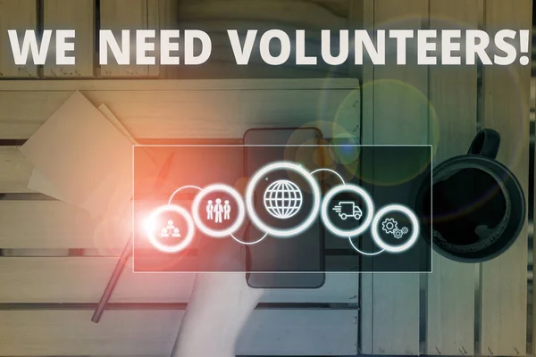 Conceptual hand writing showing We Need Volunteers. Business photo text someone who does work without being paid for it Picture photo network scheme with modern smart device. — Stock Photo, Image