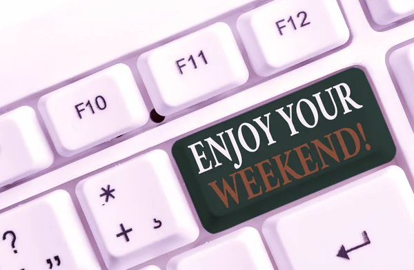 Word writing text Enjoy Your Weekend. Business concept for wishing someone that something nice will happen at holiday White pc keyboard with empty note paper above white background key copy space.