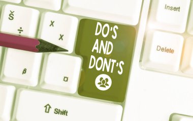 Handwriting text writing Do S And Don tS. Concept meaning Rules or customs concerning some activity or actions White pc keyboard with empty note paper above white background key copy space.