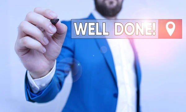 Text sign showing Well Done. Conceptual photo used praising demonstrating or group for something have done good way Businessman pointing with pen in empty copy space.