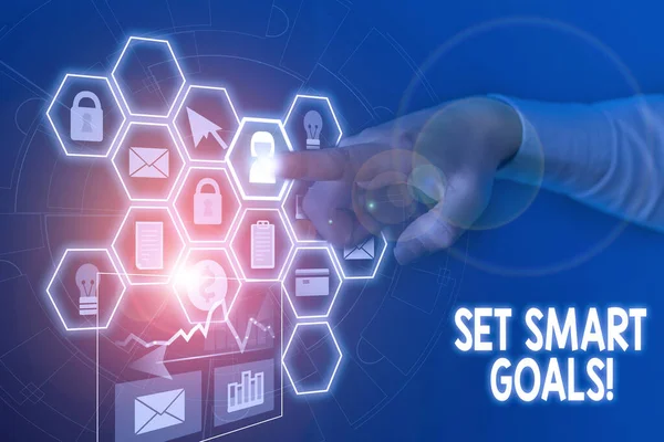 Conceptual hand writing showing Set Smart Goals. Business photo text list to clarify your ideas focus efforts use time wisely Picture photo network scheme with modern smart device.