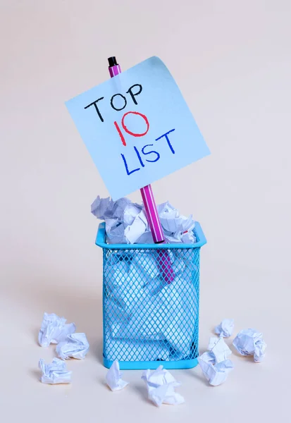 Writing note showing Top 10 List. Business photo showcasing the ten most important or successful items in a particular list crumpled paper and stationary with paper placed in the trash can. — Stock Photo, Image