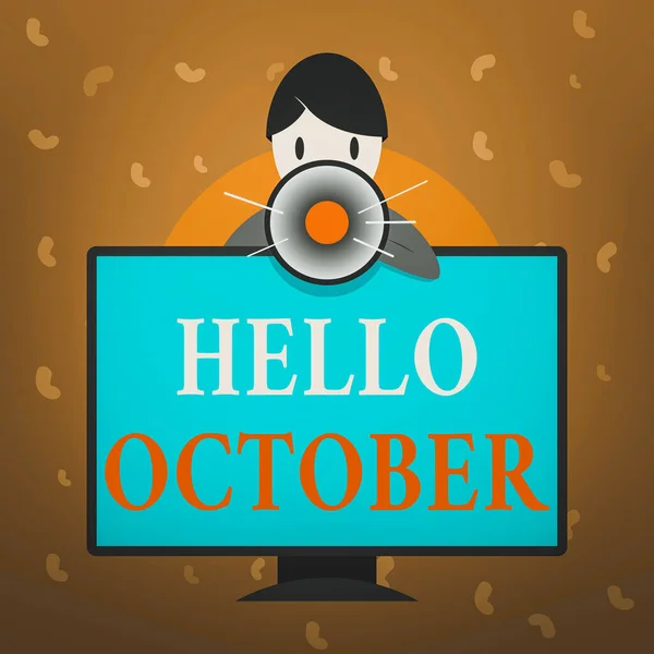 こんにちは10月を示す概念的な手書き。年の10月を歓迎するときに使用されるビジネス写真のテキスト挨拶マウントされたPCモニターの後ろの男話すとメガホンを保持. — ストック写真
