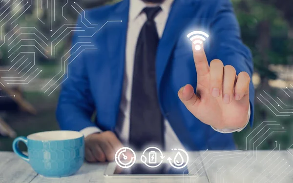Man In Futuristic Infographics Interface Elements On Blurred Χρησιμοποιώντας Free Wi Fi Hotspot Connection Icon. Internet Technology Wireless and Networking Concept. — Φωτογραφία Αρχείου