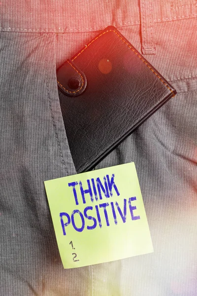 Schrijfbriefje met Think Positive. Zakelijke foto presentatie het creëren van gedachten die stimuleren en helpen opladen van een individuele kleine portemonnee in broek voorzak in de buurt notatie papier. — Stockfoto