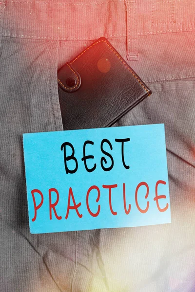 Handwriting text Best Practice. Concept meaning Selective Focus Proven Ideas for Success and Effective Small little wallet inside man trousers front pocket near notation paper.