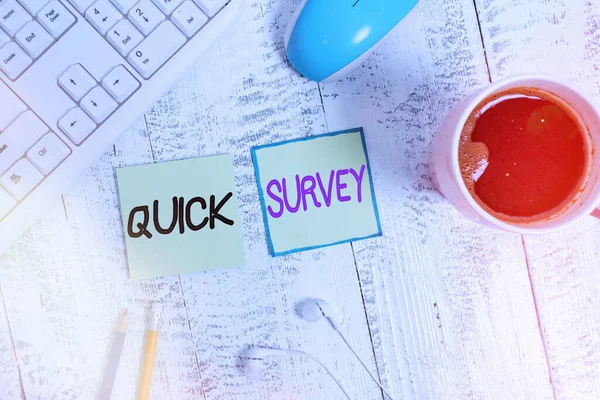 Handwriting text writing Quick Survey. Concept meaning the research method used for collecting data to gain insights or business idea Writing equipment and computer stuff plus drinks placed above — Stock Photo, Image