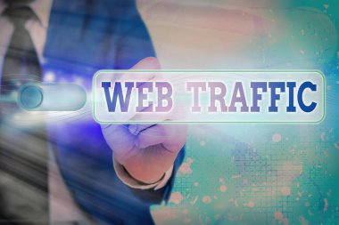 Web trafiğini gösteren bir not yazıyorum. Web kullanıcı sayısının gösterildiği iş fotoğrafı ve bir web sitesine yapılan ziyaret ölçümleri.