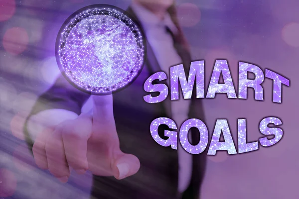 Conceptual hand writing showing Smart Goals. Business photo text mnemonic used as a basis for setting objectives and direction Elements of this image furnished by NASA. — Stock Photo, Image