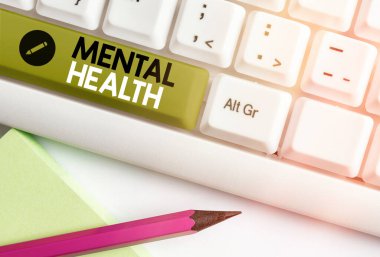 Akıl Sağlığını gösteren bir not yazıyorum. İş fotoğrafı duygusal, sosyal ve psikolojik refahın durumunu gösteriyor..