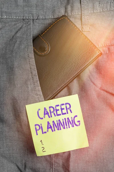 Writing note showing Career Planning. Business photo showcasing stepwise planning of one s is possible professional career Small wallet inside trouser front pocket near notation paper.