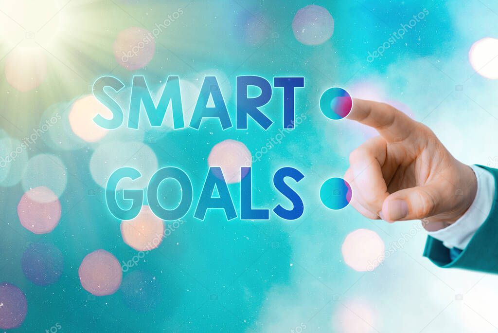 Writing note showing Smart Goals. Business photo showcasing mnemonic used as a basis for setting objectives and direction.
