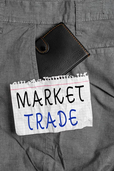 Writing note showing Market Trade. Business photo showcasing forex trading graph of financial investment or Economic trends business Small wallet inside trouser front pocket near notation paper.