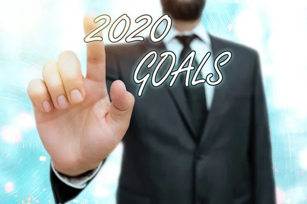 Writing note showing 2020 Goals. Business photo showcasing a targeted list of ambitions that need to be fulfilled in a year.