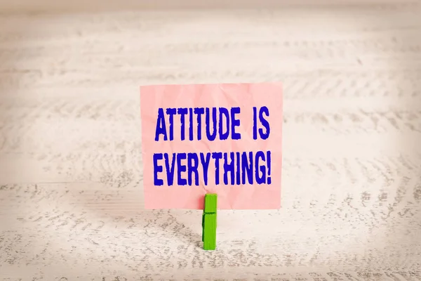 Handwriting text Attitude Is Everything. Concept meaning Personal Outlook Perspective Orientation Behavior Green clothespin white wood background colored paper reminder office supply. — Stock Photo, Image