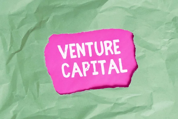 Word writing text Venture Capital. Business concept for available for investment in the ownership element of new Green crumpled ripped colored paper sheet centre torn colorful background.