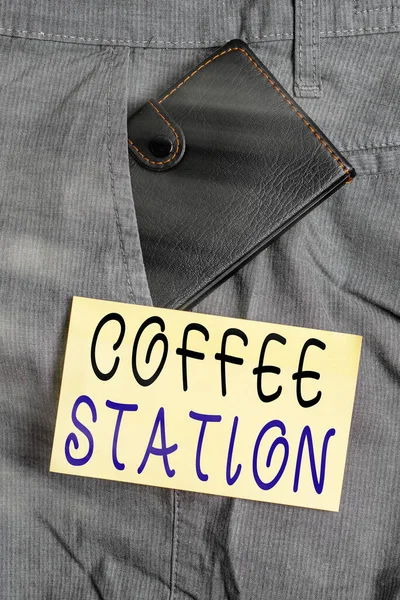 Writing note showing Coffee Station. Business photo showcasing a small, informal restaurant that typically serves hot drinks Small wallet inside trouser front pocket near notation paper.
