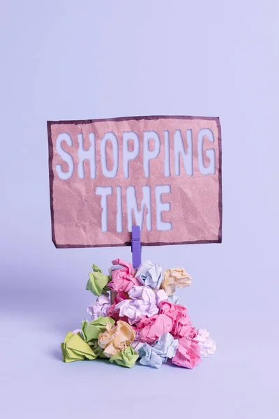 Word writing text Shopping Time. Business concept for the session allowed for buying item while visiting a different store Reminder pile colored crumpled paper clothespin reminder blue background. — Stock Photo, Image