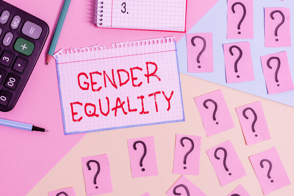 Writing note showing Gender Equality. Business photo showcasing access to same privilege given to both men and women Mathematics stuff and writing equipment above pastel colours background.