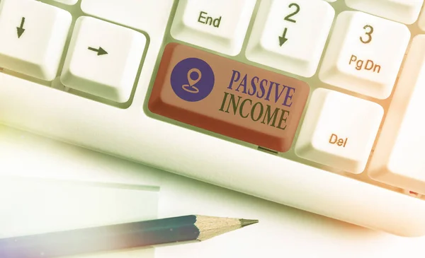 Text sign showing Passive Income. Conceptual photo earnings extracted from rental property, and other enterprises. — Stock Photo, Image