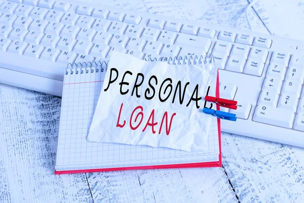 Handwriting text Personal Loan. Concept meaning unsecured loan taken by individuals from a financial company notebook paper reminder clothespin pinned sheet white keyboard light wooden. — Stock Photo, Image