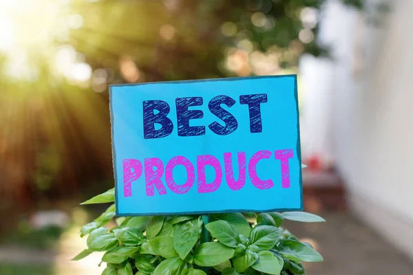 Text sign showing Best Product. Conceptual photo a certain good that is highly appreciated among its variety Plain empty paper attached to a stick and placed in the green leafy plants.