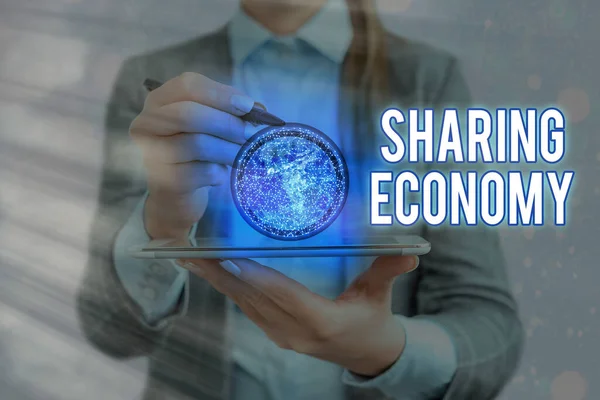Writing note showing Sharing Economy. Business photo showcasing a system where assets are shared privately between individuals Elements of this image furnished by NASA.