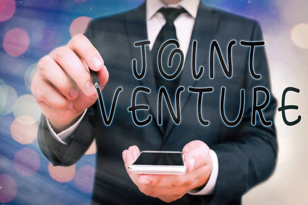 Texto de escritura a mano Joint Venture. Concepto que significa asociación empresarial invertida conjuntamente por dos o más empresas . — Foto de Stock