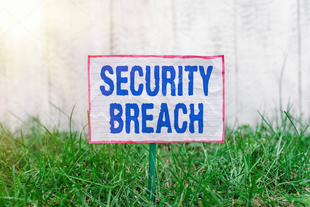 Text sign showing Security Breach. Conceptual photo unauthorized access of data gained by a malicious intruder Crumpled paper attached to a stick and placed in the green grassy land.