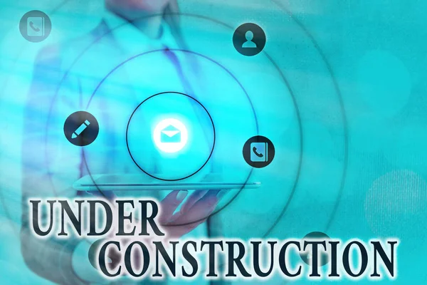 Text sign showing Under Construction. Conceptual photo building that is unfinished but actively being worked on Information digital technology network connection infographic elements icon. — Stock Photo, Image