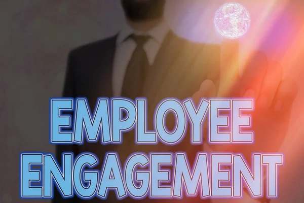 Handwriting text writing Employee Engagement. Concept meaning extent to which workers feel passionate about their jobs Elements of this image furnished by NASA.