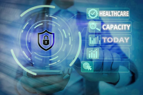Word writing text Healthcare Capacity. Business concept for maximum amount of patients provided with the right medical service Graphics padlock for web data information security application system.