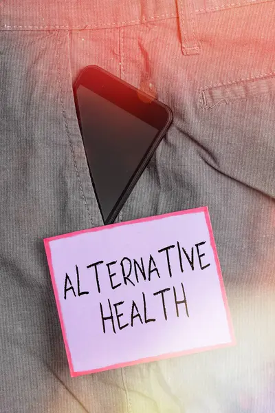 Text sign showing Alternative Health. Conceptual photo medical practices that are not part of standard care Smartphone device inside formal work trousers front pocket near note paper.