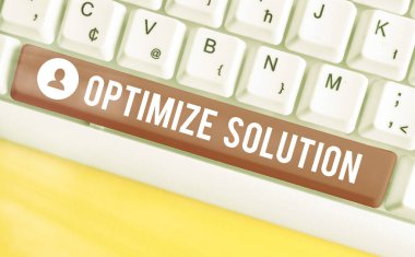 Çözümü İyimserleştir 'i gösteren not yazılıyor. Çözümün en büyük değerini bulmak için iş fotoğrafı gösterme süreci.