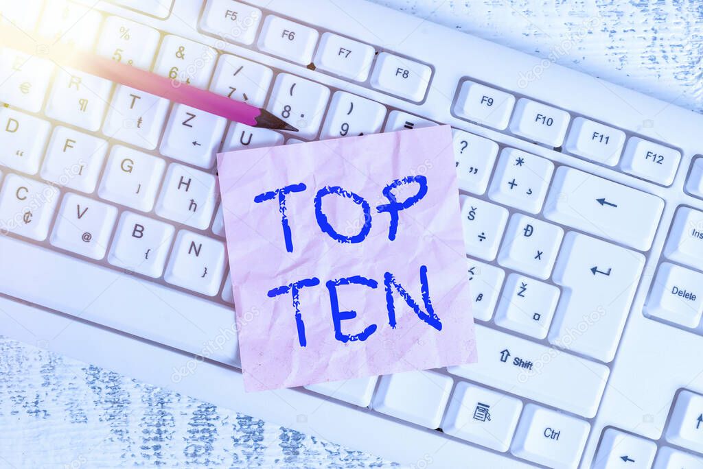 Handwriting text writing Top Ten. Concept meaning items that are listed as the most popular and successful arranged in order White keyboard office supplies empty rectangle shaped paper reminder wood.