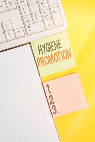 Tekst schrijven Hygiëne Promotie. Bedrijfsconcept voor systematisch programma om gerelateerde ziekte met sanitaire voorzieningen te voorkomen Lege papieren met kopieerruimte op gele achtergrondtabel. — Stockfoto