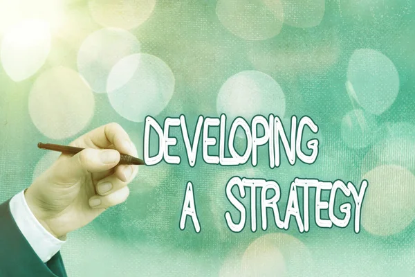 Conceptual hand writing showing Developing A Strategy. Business photo text Discussing the Ideas for New Goal Marketing Vision Planning Business. — Stock Photo, Image