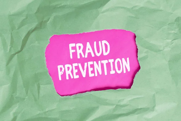 Word writing text Fraud Prevention. Business concept for to secure the enterprise and its processes against hoax Green crumpled ripped colored paper sheet centre torn colorful background.