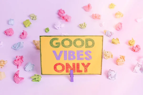 Writing note showing Good Vibes Only. Business photo showcasing a positive way of living and optimism with good effect to other showing Colored crumpled paper empty reminder white floor clothespin.