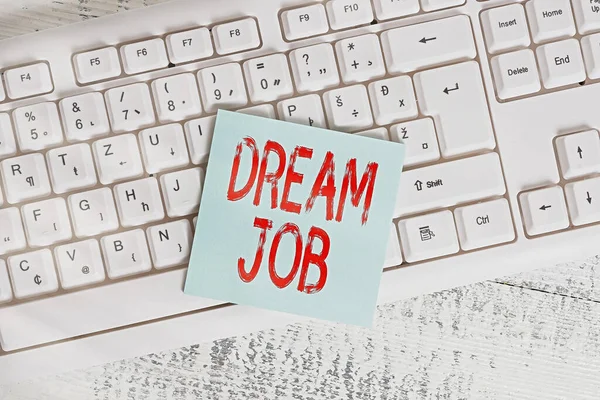 Escritura a mano conceptual que muestra Dream Job. Foto de negocios mostrando la carrera profesional que un individuo está trabajando duro para ganarlo Teclado oficina suministros rectángulo forma papel recordatorio madera . — Foto de Stock