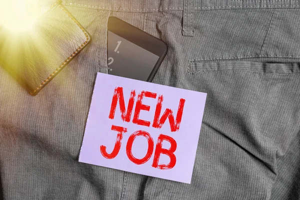 Writing note showing New Job. Business photo showcasing starting afresh career with the given opportunity or employment Smartphone device inside trousers front pocket with wallet. — Stock Photo, Image