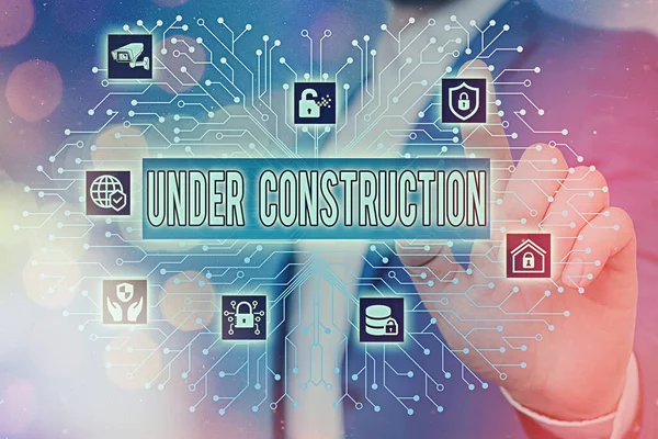 Text sign showing Under Construction. Conceptual photo building that is unfinished but actively being worked on System administrator control, gear configuration settings tools concept. — Stock Photo, Image