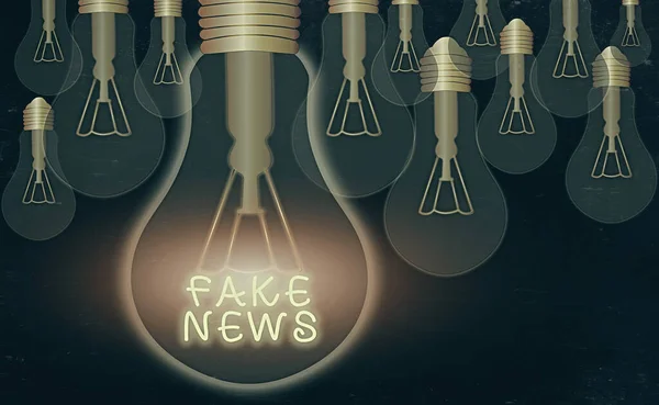 Word writing text Fake News. Business concept for false information publish under the guise of being authentic news Realistic colored vintage light bulbs, idea sign solution thinking concept.