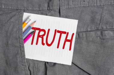 Sözcük yazma Doğruluk. İş konsepti, gerçek gerçeklik ya da standart yazma ekipmanlarına sadakat ve insan iş pantolonunun cebindeki beyaz not kağıdına uymak demekti..