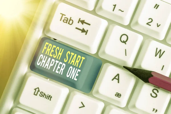 Text sign showing Fresh Start Chapter One. Conceptual photo changes in your circumstances new career and chances White pc keyboard with empty note paper above white key copy space.